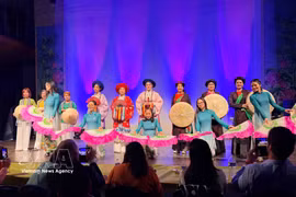 An ao dai fashion show at the grand music programme on March 8, presented by the Vietnamese ao dai heritage club in Belgium in coordination with the UGVB Women’s Association. (Photo: VNA)