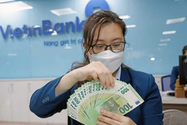 The Government aims to increase 2025 State budget revenue by at least 25% over the estimates. (Photo: VNA)