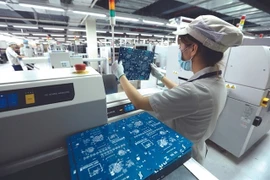 Workers at a VNPT factory at the Hoa Lac Hi-tech Park in Hanoi (Photo: VNA)