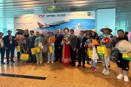 Russian visitors on the first Nordwind flight to Khanh Hoa arrive in the province on September 29. (Photo: VNA)