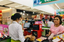 The total retail sales of goods and consumer service revenue were estimated at 5.7 quadrillion VND for the first 10 months of the year. (Photo: VNA)