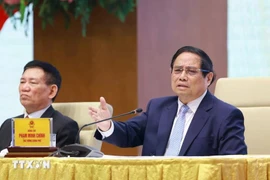 Prime Minister Pham Minh Chinh speaks at the meeting with SOEs in Hanoi on April 15. (Photo: VNA)