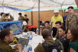 Prime Minister Paetongtarn Shinawatra listens to a briefing by a team of Israeli rescuers who are part of an international contingent working at the collapsed building site in Bangkok. (Photo: Bangkok Post)