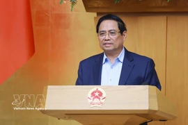 Prime Minister Pham Minh Chinh addresses the Government’s regular meeting for February on March 4. (Photo: VNA)