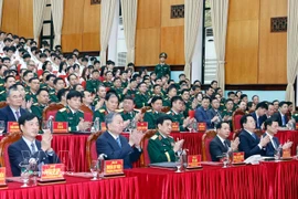 Party General Secretary To Lam (front, second, left) attends a meeting with the Military Technical Academy on March 17. (Photo: VNA)