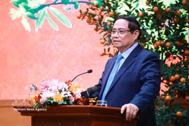 Prime Minister Pham Minh Chinh addresses the reception for outstanding intellectuals, artists, journalists, athletes, coaches and representatives of cultural and tourism enterprises on February 23. (Photo: VNA)
