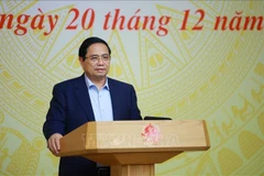 Prime Minister Pham Minh Chinh addresses he third meeting of the National Steering Committee implementing the Politburo’s Resolution 68 in Hanoi on December 20. (Photo: VNA)