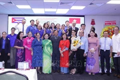 Participants of the get-together in a group photo (Source: VNA)