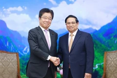 Prime Minister Pham Minh Chinh and Japanese Minister of Finance Kato Katsunobu at their meeting in Hanoi on January 8 (Photo: VNA)