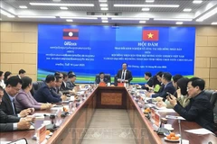 At the meeting between the People's Councils of Hai Duong and Vientiane provinces. (Photo: VNA)