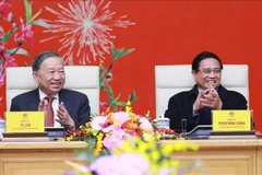 Party General Secretary To Lam (left) and Prime Minister Pham Minh Chinh at the gathering on February 3. (Photo: VNA)