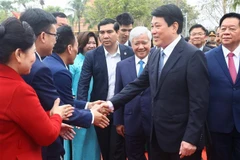 State President Luong Cuong (2nd from right) and participants of the festival honouring the traditional cultural values of the 54 ethnic groups held in Hanoi on February 15. (Photo: VNA)