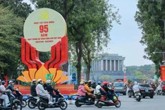 A large emblem celebrating the 95th anniversary of the Communist Party of Vietnam on Dien Bien Phu street, Hanoi. (Photo: VNA) 