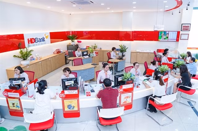 HDBank staff assist customers with transactions. — Photo courtesy of the bank