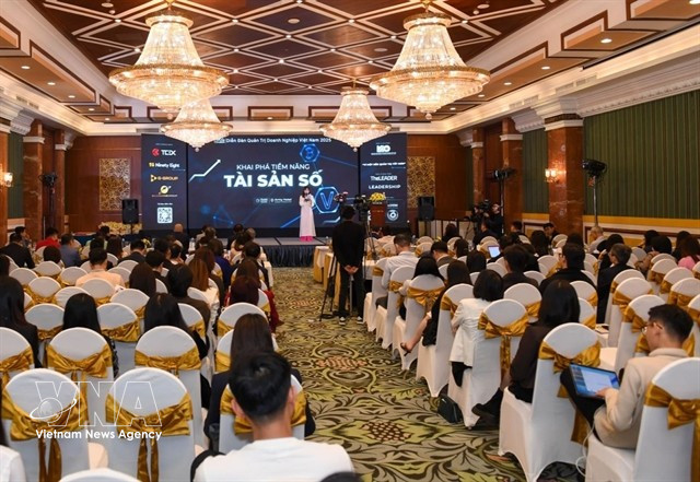 Participants at a conference on digital assets in Hanoi on December 10. (Photo: VNA)