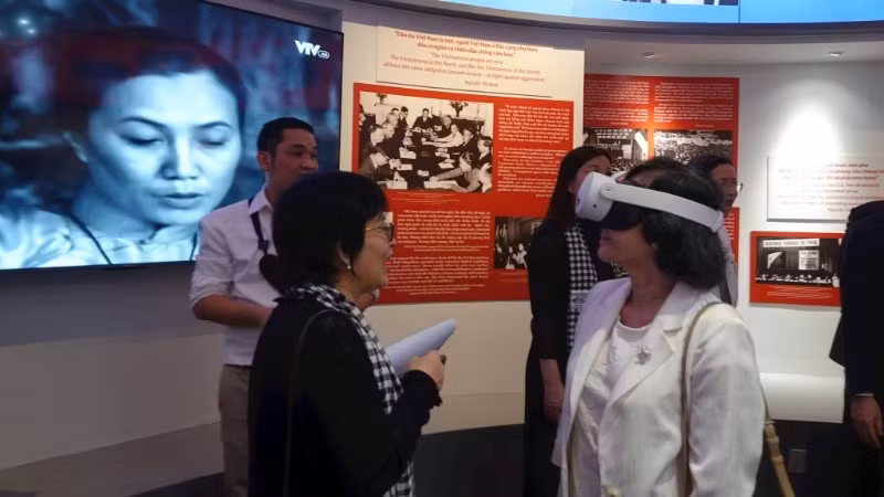 Visitors experience a digital interactive exhibition space at the War Remnants Museum in Ho Chi Minh City. (Photo: nhandan.vn) 