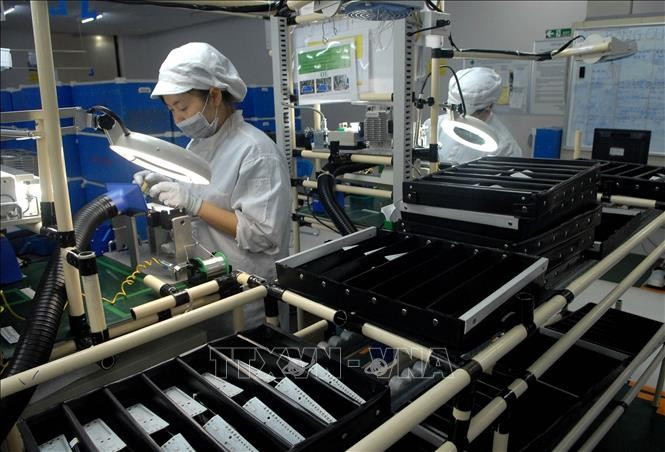 A production line for electronic devices and automotive and motorcycle lighting equipment at Vietnam Stanley Electric Co., Ltd, a Japanese-invested company in Hanoi. (Photo: VNA)