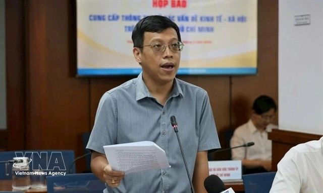 Nguyen Hoang Anh, deputy head of the General Policy Division at the municipal Department of Finance, speaks at the press briefing. (Photo: VNA)