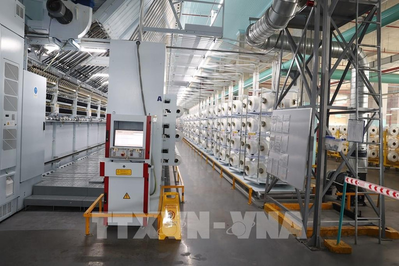 The yarn factory of Unitex Textile and Dyeing Company Limited applies new technology to optimise operations using an automated model. (Photo: VNA)