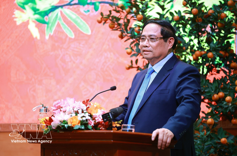 Prime Minister Pham Minh Chinh addresses the reception for outstanding intellectuals, artists, journalists, athletes, coaches and representatives of cultural and tourism enterprises on February 23. (Photo: VNA)
