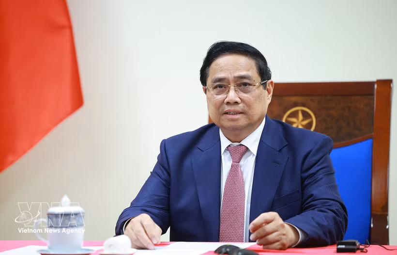 Prime Minister Pham Minh Chinh speaks at the phone talks with Angolan President Joao Manuel Goncalves Lourenco on March 16. (Photo: VNA)