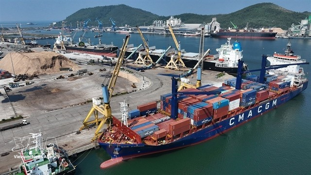 Containers are unloaded at Nghi Son International Port in Thanh Hoa province. (Photo: VNA)