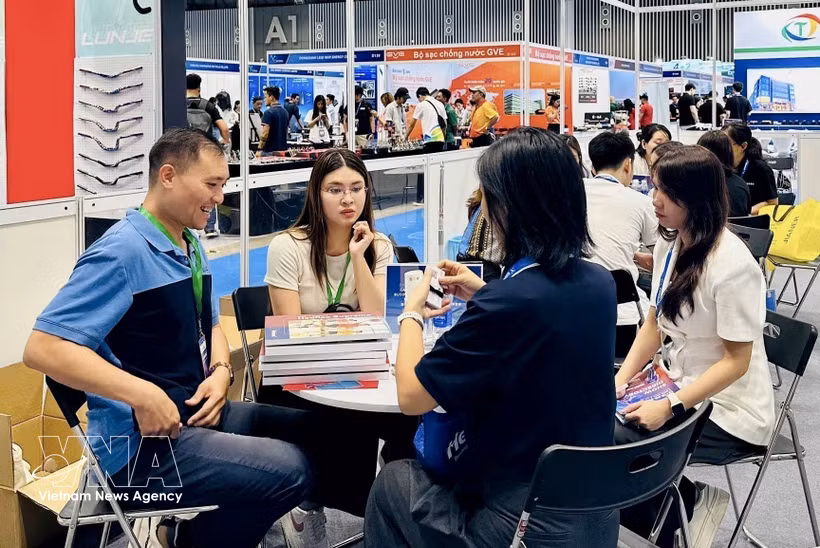 Domestic and foreign businesses engage in trade networking at the event series held at Ho Chi Minh's Saigon Exhibition and Convention Centre (SECC) on August 13, 2026. (Photo: VNA)