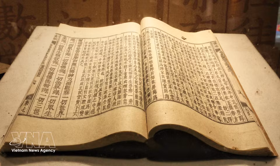 The content of the woodblocks is printed into books. (Photo: VNA)