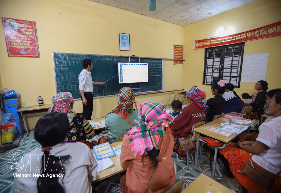 The class is special, with some learners already grandmothers and others carrying their children on their backs to attend lessons. (Photo: VNA)