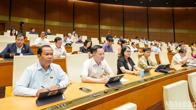 Deputies participate in 15th National Assembly’s ongoing 9th session (Photo: nhandan.vn)