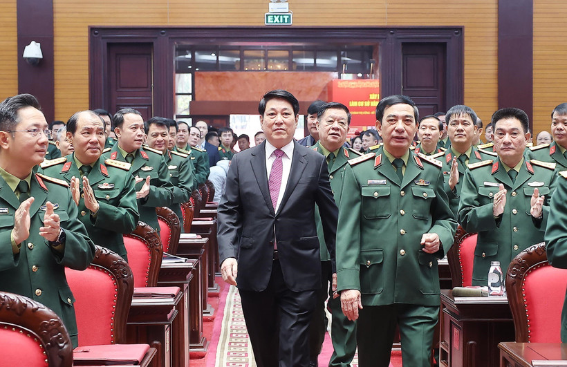 State President Luong Cuong (in black suite) attends the national political-military conference in Hanoi on December 17. (Photo: VNA)