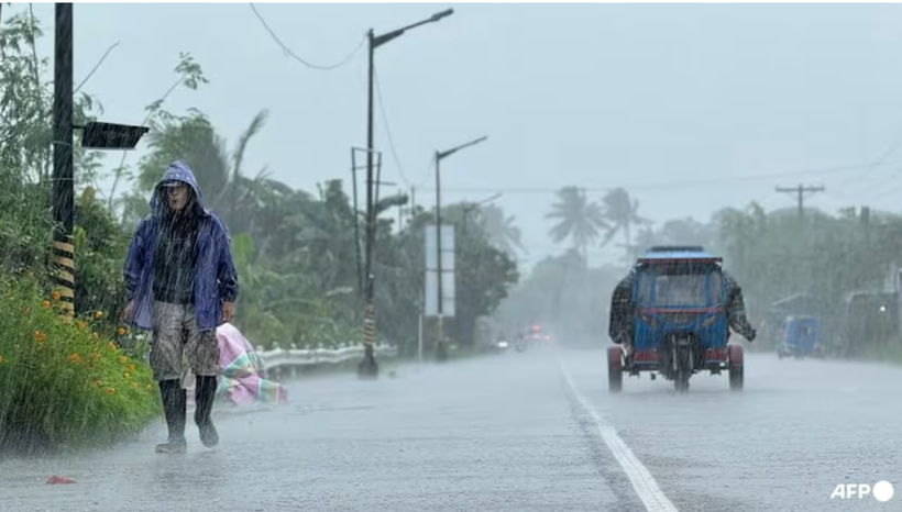 A man walks along a road amid heavy rain due to weather patterns from Super Typhoon Ragasa in Lal-lo town, Cagayan province on Sep 22, 2025. (Photo: AFP)