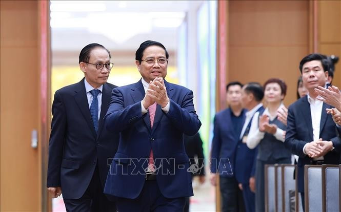 Prime Minister Pham Minh Chinh attends the national conference reviewing the implementation of Resolution No. 36-NQ/TW on OV affairs and guiding documents of the Party Central Committee's Politburo and Secretariat in this field (Photo: VNA) 