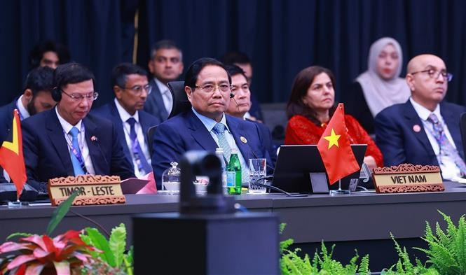 Prime Minister Pham Minh Chinh (C) attends the 22nd ASEAN-India Summit (Photo: VNA)