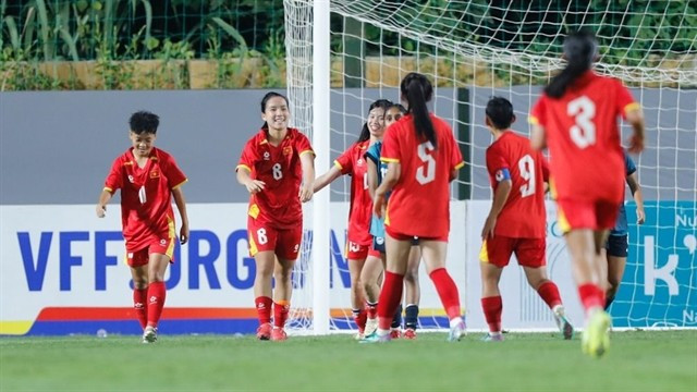 Vietnamese players celebrate after scoring in their 5-0 win over Singapore in their first match of the AFC U20 Women’s Asian Cup 2026 Qualifiers Group B ties on August 6 in Hanoi. (Photo: the-afc.com)