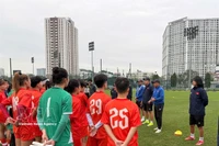 Coaches and players of the national women's U20 team discus before their training. The team will compete in the AFC U20 Women’s Asian Cup 2026 next month in Thailand. (Photo: VNA)