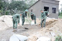The house for a family affected by natural disasters is being urgently constructed by soldiers of Regiment 974, Khanh Hoa provincial Military Command. (Photo: VNA)