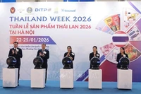 Delegates perform the opening ceremony. (Photo: VNA)