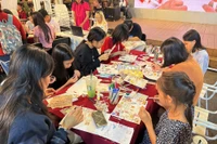 Young people enjoy the activities at Nguyen Van Binh book street. (Photo: ttbc-hcm.gov.vn)