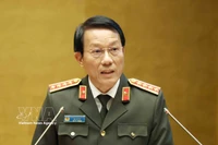 General Luong Tam Quang, Politburo member and Minister of Public Security, speaks at the national conference in Hanoi on February 7. (Photo: VNA)