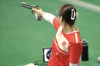 Shooter Trinh Thu Vinh competes in the women’s 10m air pistol team event. (Photo: VNA)