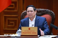 Prime Minister Pham Minh Chinh speaks at the meeting between the Government’s standing members and ministries, sectors and localities on December 16 on preparations for the ground-breaking and inauguration ceremonies for projects celebrating the 14th National Party Congress (Photo: VNA)