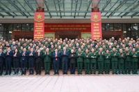 Party General Secretary To Lam (ninth, left, front row) and delegates at the meeting pose for a group photo. (Photo: VNA)