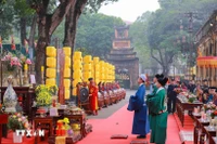 The recreation of Tien lich (calendar presentation ceremony), an important year-end ritual in which the royal court presented the new calendar for the coming year to the king, within a programme at the Thang Long Imperial Citadel in Hanoi on February 10. (Photo: VNA)