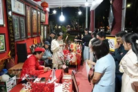 Visitors explore a calligraphy writing space in Thuan Hoa ward, Hue city, during the Lunar New Year 2026. (Photo: VNA)