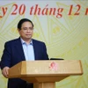 Prime Minister Pham Minh Chinh addresses he third meeting of the National Steering Committee implementing the Politburo’s Resolution 68 in Hanoi on December 20. (Photo: VNA)