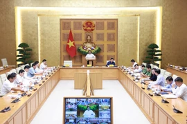Prime Minister Pham Minh Chinh chairs a teleconference to review recovery efforts following the devastating impact of Typhoon Bualoi, and to prepare for the arrival of Typhoon Matmo. (Photo: VNA)