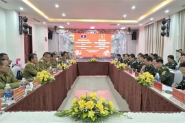 An overview of the annual meeting between the Border Guard Command of Quang Tri and the Department of Public Security of Savannakhet. (Photo: VNA)
