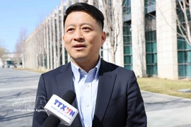 Professor Qu Qiang, commentator for the China Global Television Network (CGTN) and lecturer at the Minzu University of China, in an interview with the Vietnam News Agency (Photo: VNA)