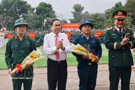 National Assembly Chairman Tran Thanh Man (second from left) at the military handover and enlistment ceremony. (Photo: VNA)